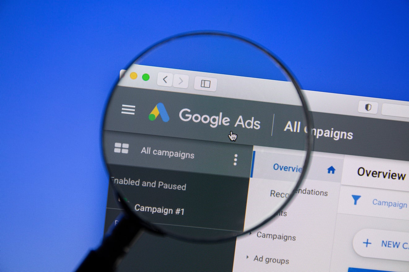 Google's AI-Powered Ads google ads dashboard with magnifying glass over the words google ads
