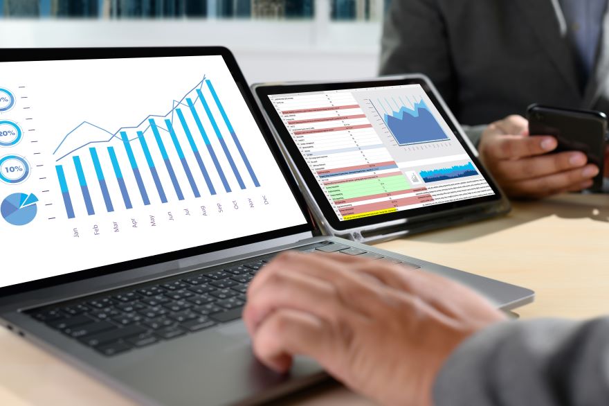 Algo Rolling Update Resize Photo of a laptop and a tablet with graph data on the screen.
