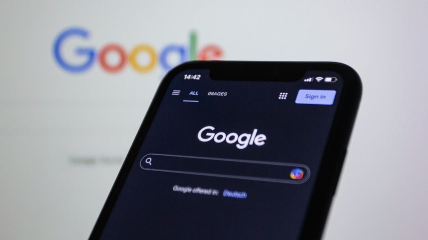 August SERP volatility Mobile device showing the Google homepage in dark mode