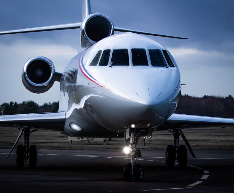 lux jets plane a private jet on the runway in twilight