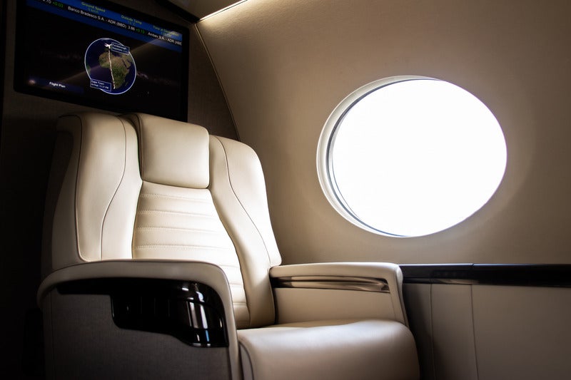 IMG_3558 copy a luxury seat on a private jet getting hit with light from the window
