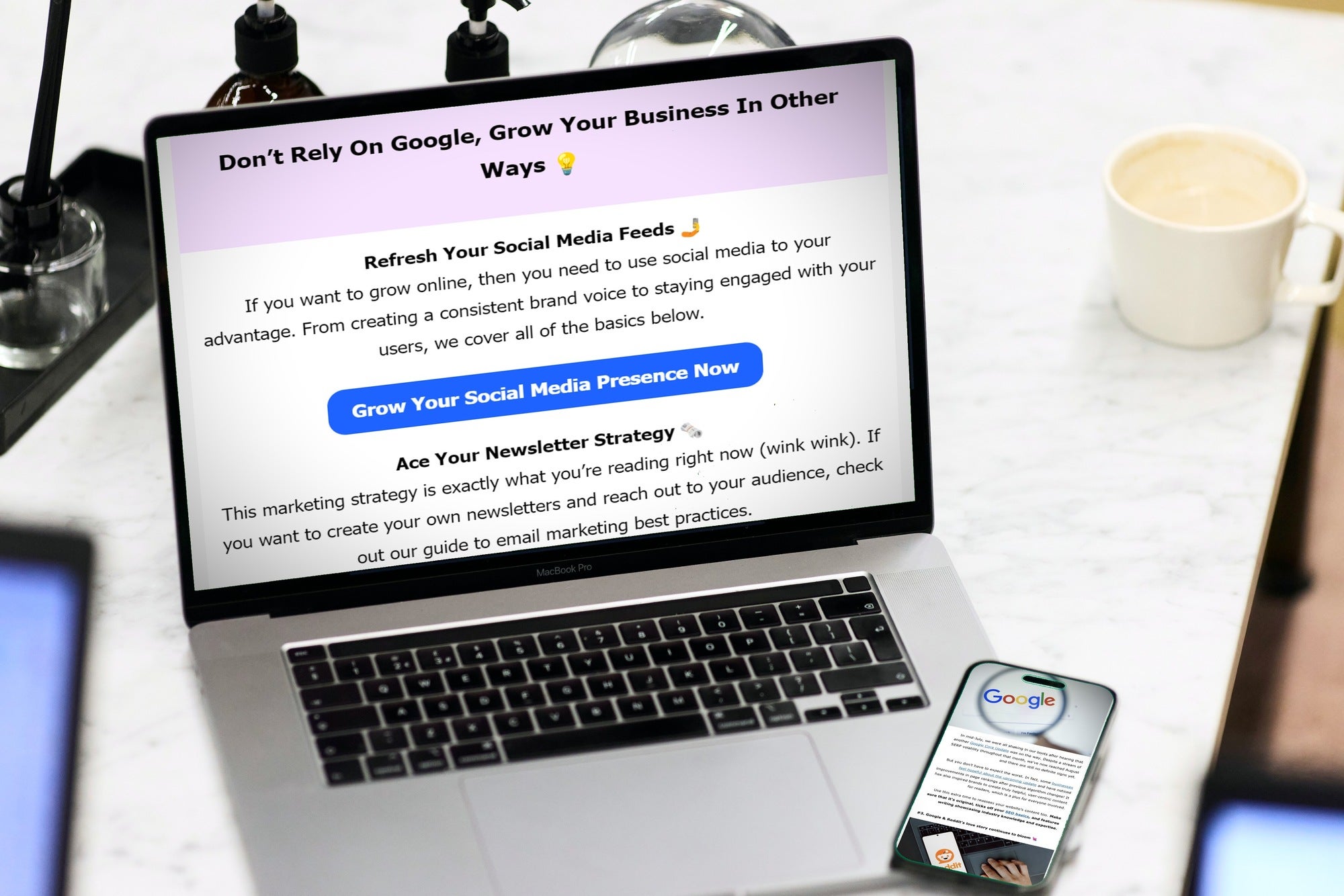 Website Builder Expert newsletter on laptop and mobile Smartphone sits on an open laptop, with the Website Builder Expert newlsetter open on both screens