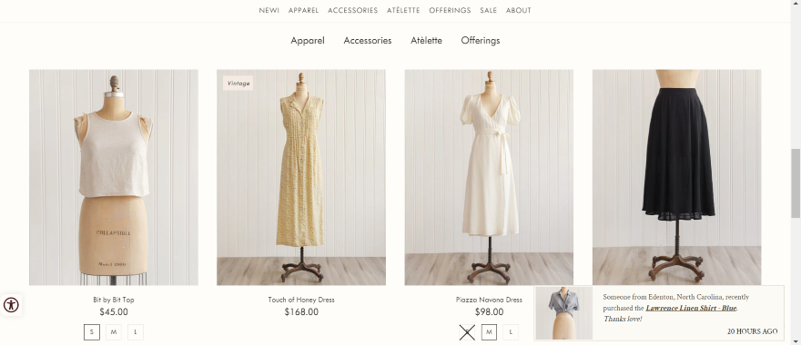 Adored Vintage Website Screenshot of Adored Vintage's homepage with ecommerce section showcasing clothing.