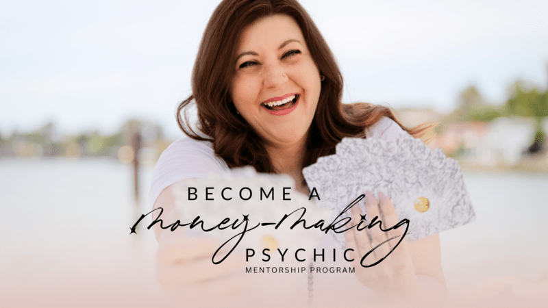 tana newberry headshot woman smiles holding henna patterned cards with black, ink-style text in forefront
