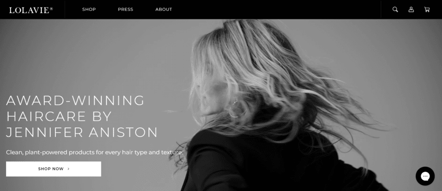 Lolavie LolaVie website homepage showing a shop now button on top of a video of Jennifer Aniston